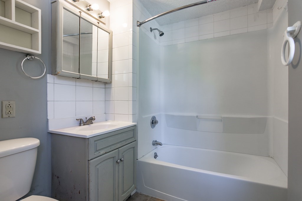139 Baldwin Street Lowell, MA 01851 - Photo 17 of 39 a bathroom with a sink a toilet and shower