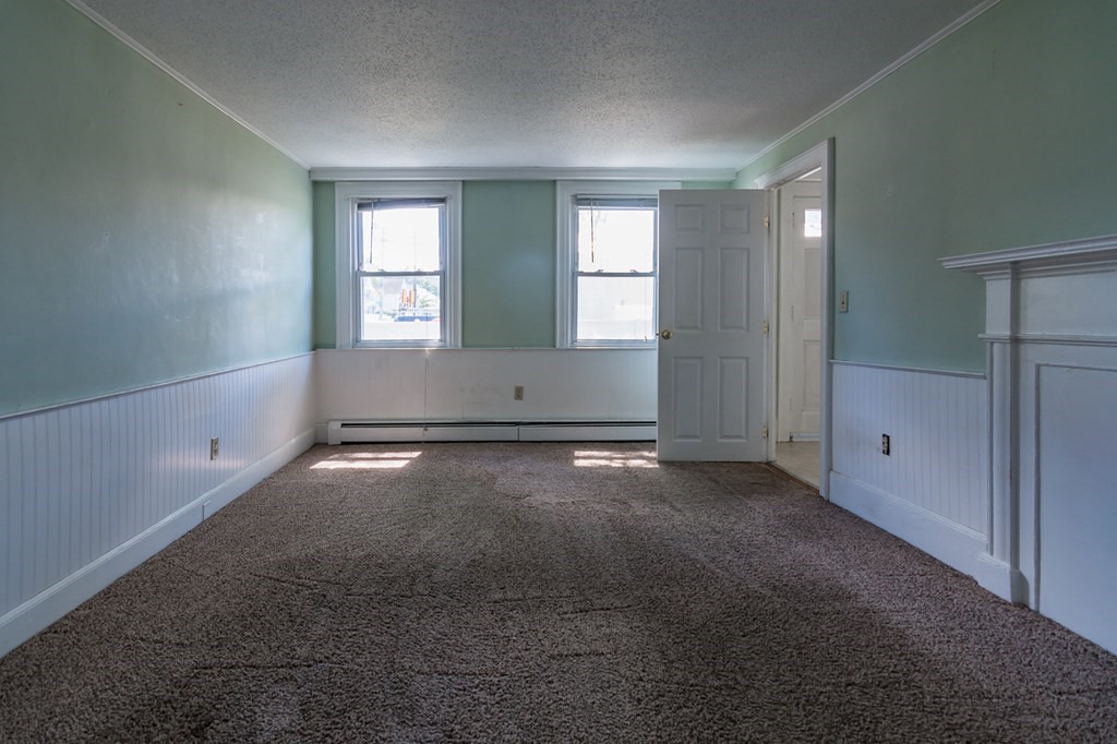 139 Baldwin Street Lowell, MA 01851 - Photo 22 of 39 an empty room with windows
