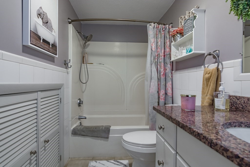 139 Baldwin Street Lowell, MA 01851 - Photo 27 of 39 a bathroom with a granite countertop sink toilet and shower