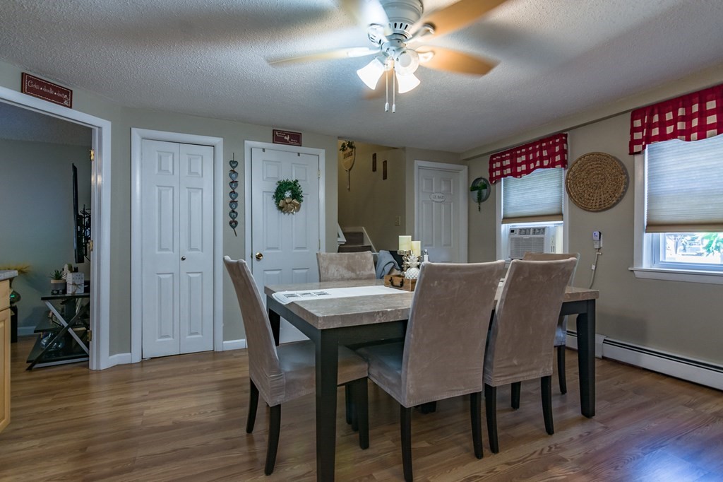 139 Baldwin Street Lowell, MA 01851 - Photo 32 of 39 a view of a dining room with furniture and wooden floor