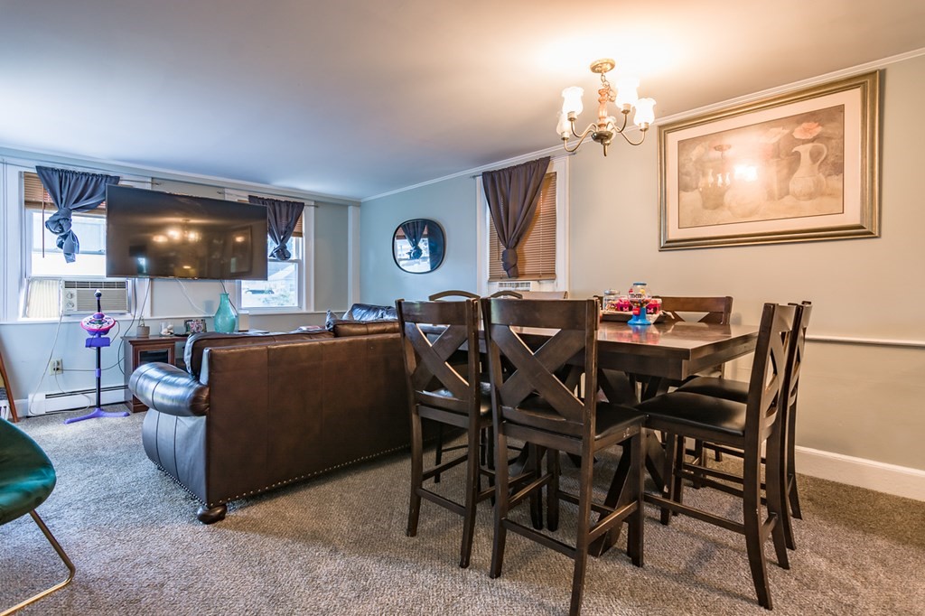 139 Baldwin Street Lowell, MA 01851 - Photo 6 of 39 a view of a dining room with furniture and chandelier