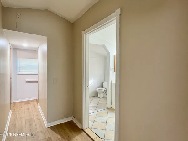 a view of a bathroom from a hallway