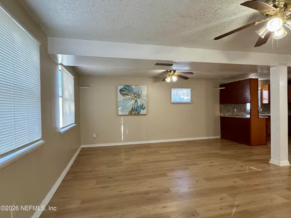 a view of livingroom with hardwood floor and a ceiling fan