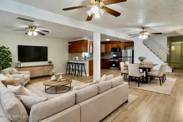 a living room with furniture and a flat screen tv
