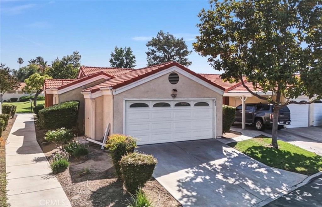 3738 Harrison Street, Unit 31 Riverside, CA 92503 - Photo 1 of 25 a front view of a house with garden