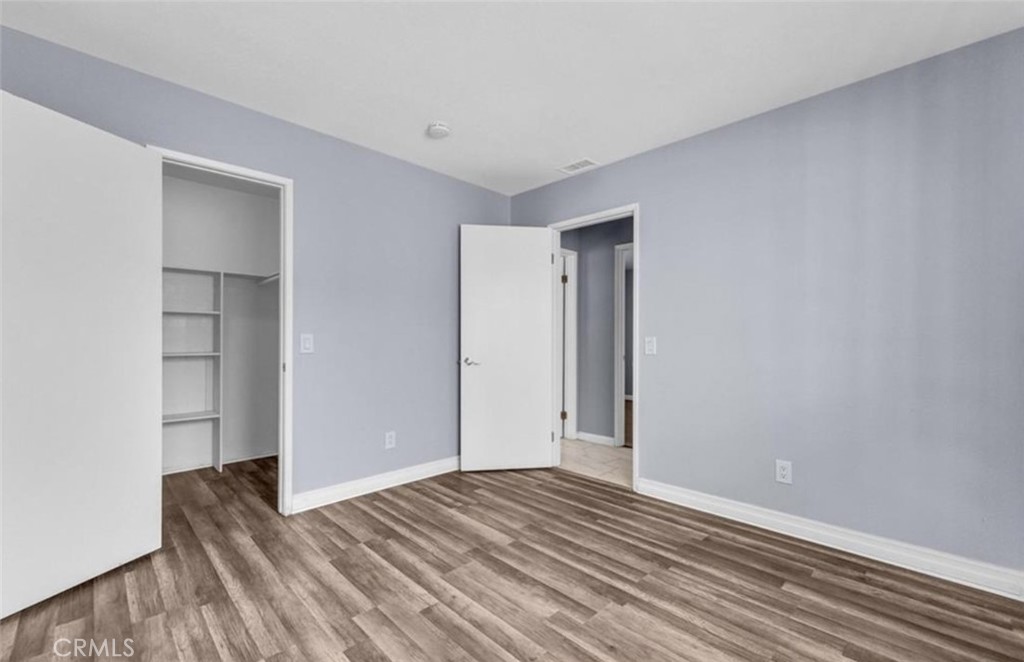 3738 Harrison Street, Unit 31 Riverside, CA 92503 - Photo 15 of 25 a view of empty room with wooden floor