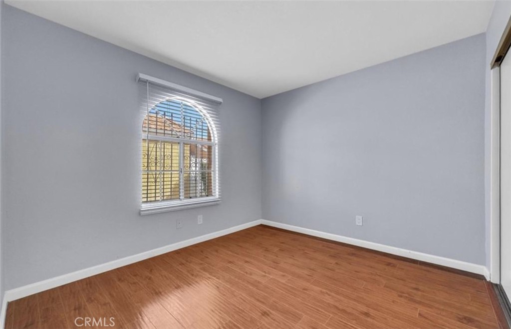 3738 Harrison Street, Unit 31 Riverside, CA 92503 - Photo 17 of 25 wooden floor in an empty room with a window