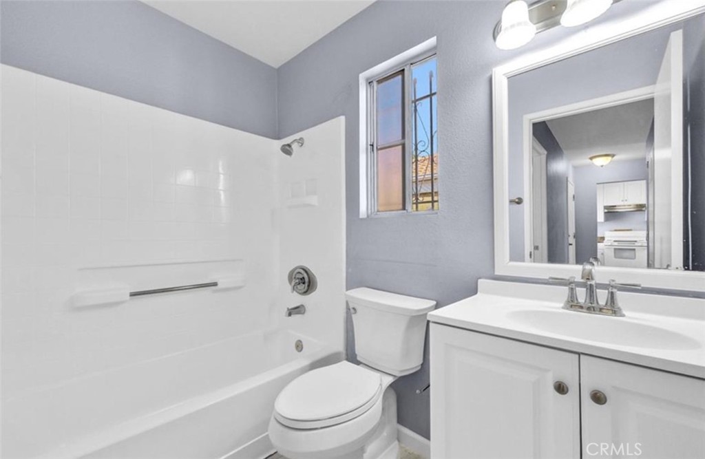 3738 Harrison Street, Unit 31 Riverside, CA 92503 - Photo 19 of 25 a bathroom with a sink a toilet and shower