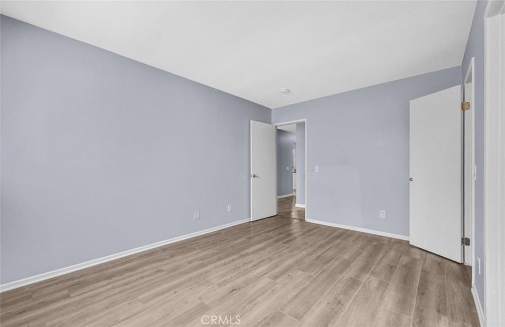 3738 Harrison Street, Unit 31 Riverside, CA 92503 - Photo 20 of 25 a view of an empty room with wooden floor