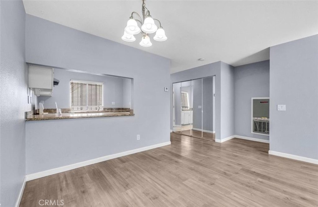 3738 Harrison Street, Unit 31 Riverside, CA 92503 - Photo 8 of 25 a view of a kitchen with wooden floor and a kitchen