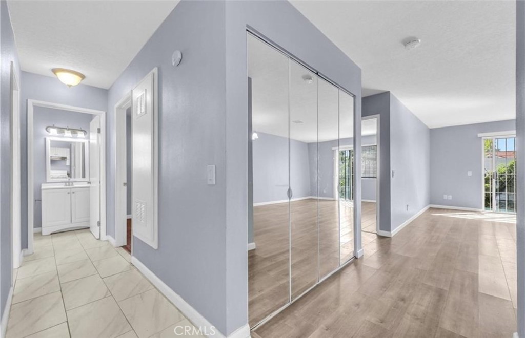 3738 Harrison Street, Unit 31 Riverside, CA 92503 - Photo 9 of 25 a view of a hallway with wooden shelves
