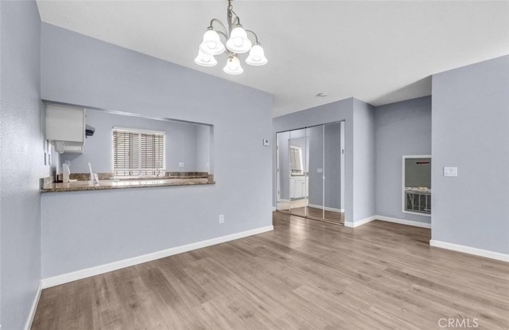 3738 Harrison Street, Unit 31 Riverside, CA 92503 - Photo 10 of 25 a view of a kitchen with wooden floor and a kitchen