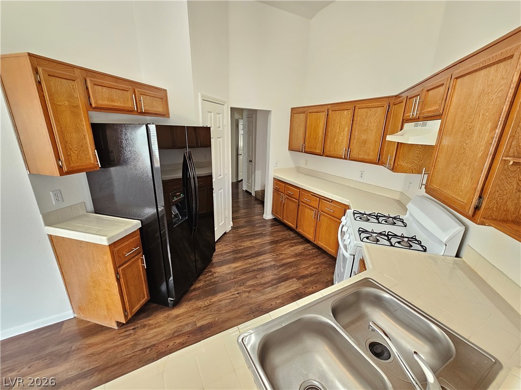 2817 Albemarle Way Henderson, NV 89014 - Photo 2 of 25 A well-equipped kitchen provides ample cabinetry, expansive counter space, and durable flooring for daily living.