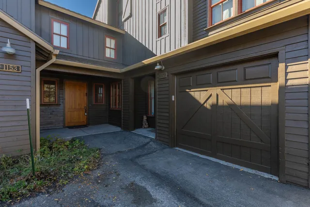 a view of yellow house with a large door