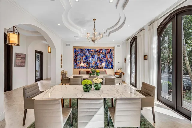 a large kitchen with stainless steel appliances granite countertop a lot of counter space and a sink