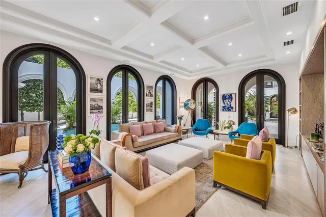 a view of a dining room with furniture window and potted plants