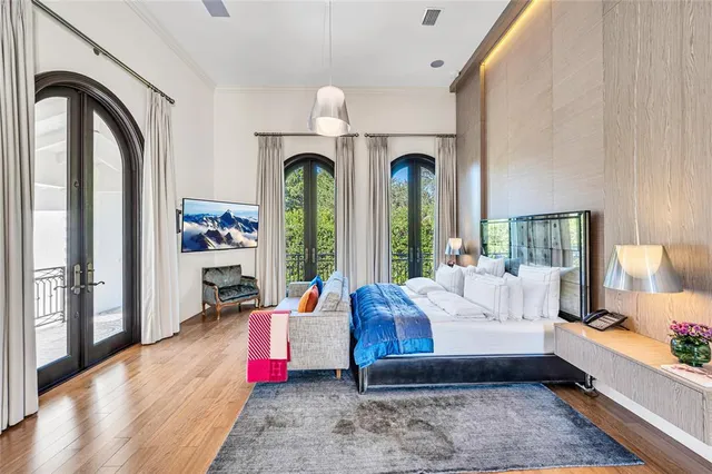 a view of a house with wooden floor and a large window