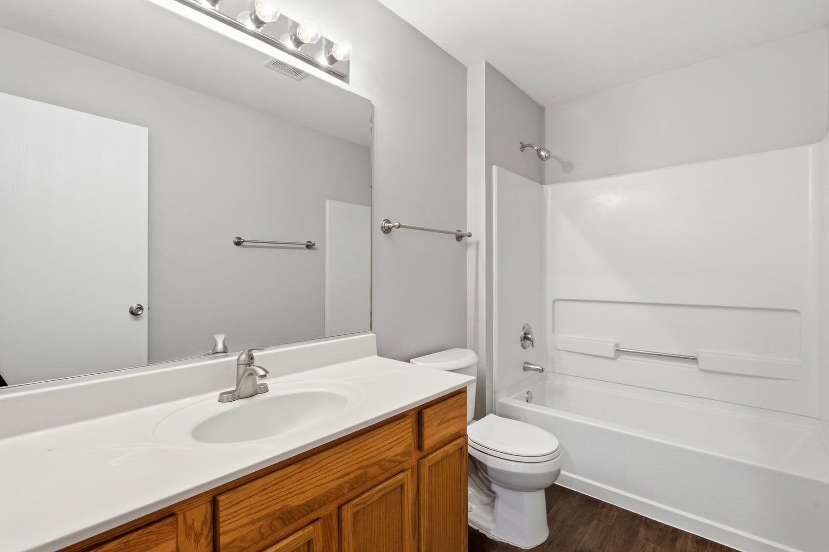 2023 Silverstone Drive, Unit 2023 Carpentersville, IL 60110 - Photo 14 of 19 a bathroom with a sink a toilet and shower