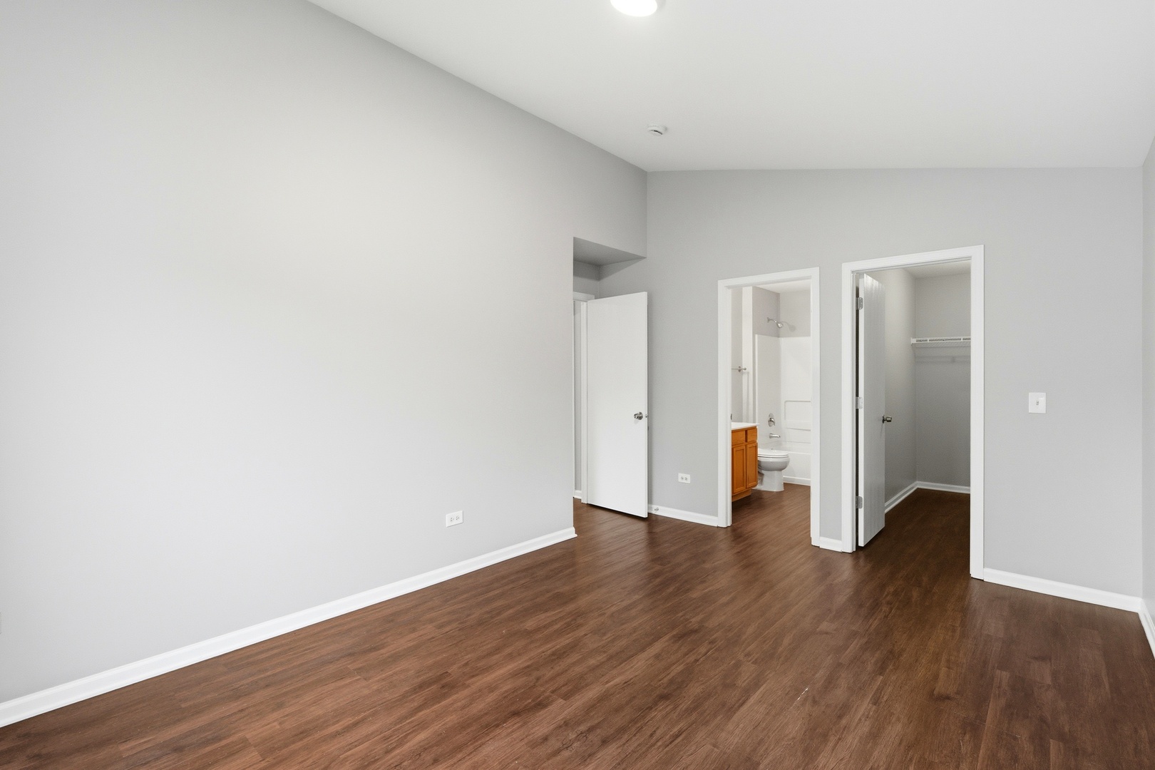 2023 Silverstone Drive, Unit 2023 Carpentersville, IL 60110 - Photo 17 of 19 a view of an empty room with wooden floor