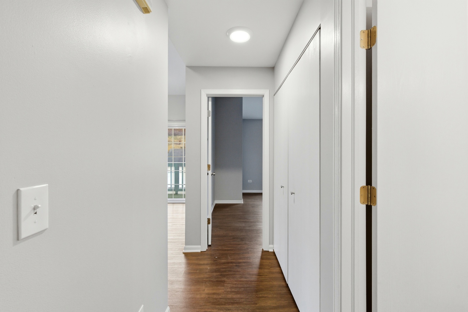 2023 Silverstone Drive, Unit 2023 Carpentersville, IL 60110 - Photo 18 of 19 a view of a hallway with wooden floor