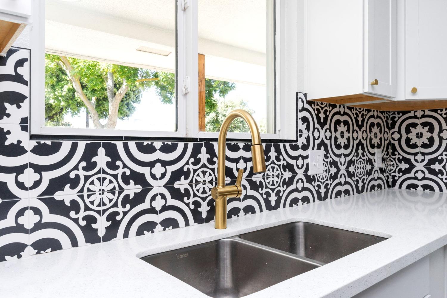 3086 West Hampton Way Fresno, CA 93722 - Photo 13 of 33 a view of a sink and a window