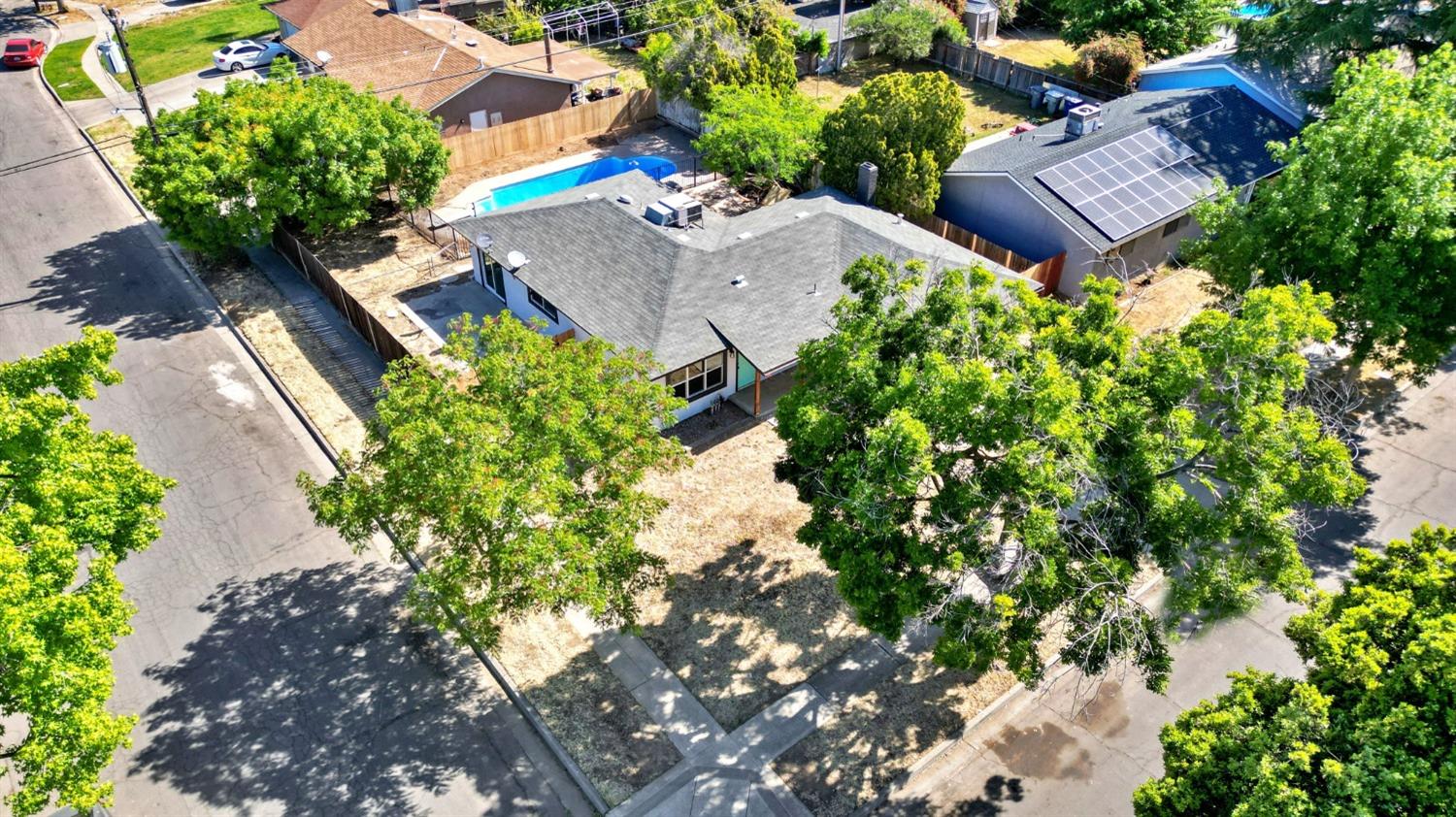 3086 West Hampton Way Fresno, CA 93722 - Photo 30 of 33 an aerial view of house with yard