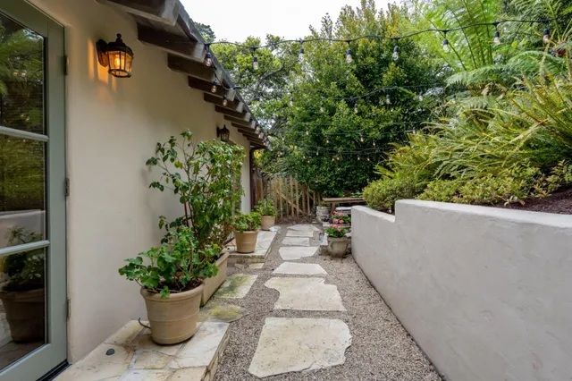 a view of a backyard with sitting area