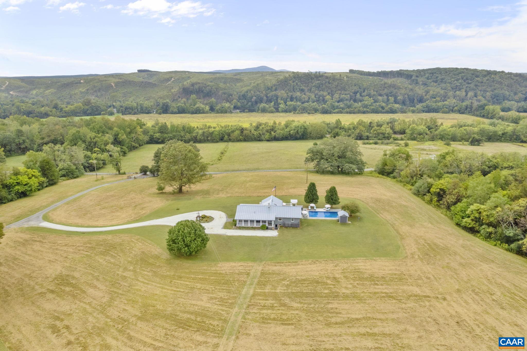 12189 Norwood Road Wingina, VA 24599 - Photo 1 of 75 a view of a lake with a mountain
