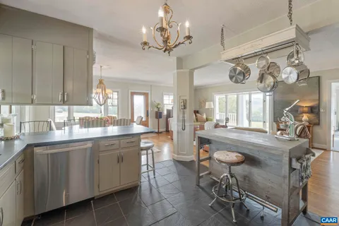 a bedroom with furniture and large windows