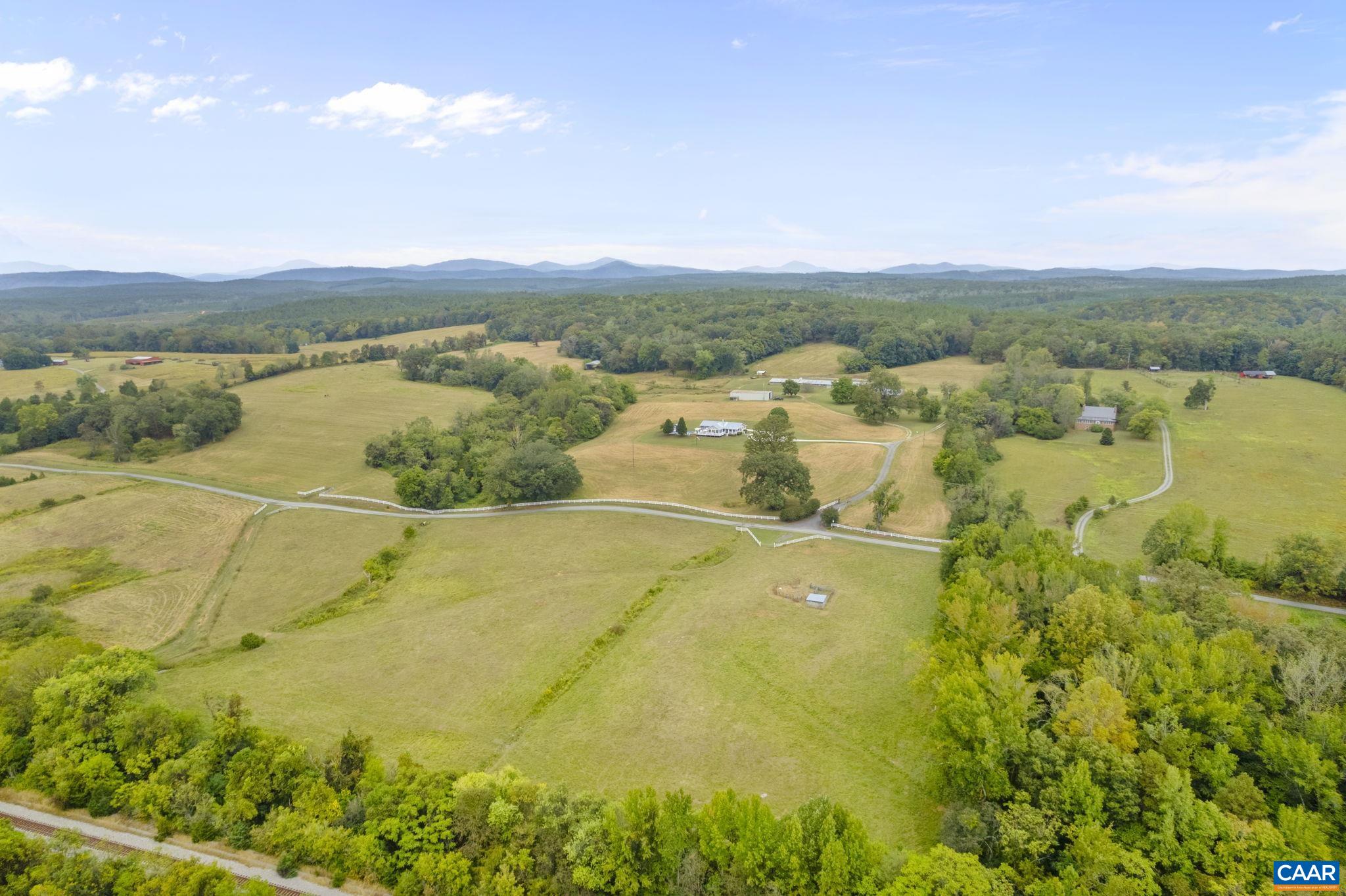 12189 Norwood Road Wingina, VA 24599 - Photo 28 of 75 a view of a lake with a house in the background