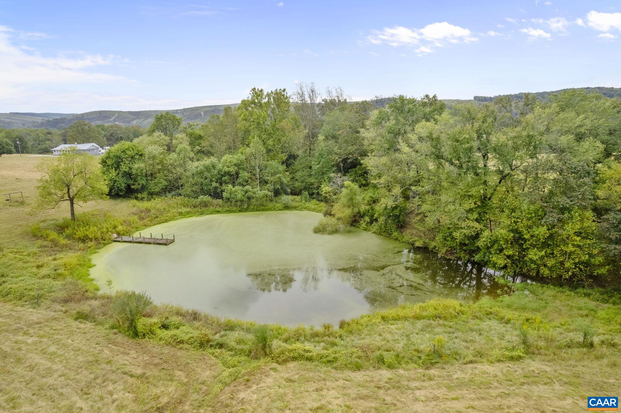 12189 Norwood Road Wingina, VA 24599 - Photo 34 of 75 a view of a lake with a yard