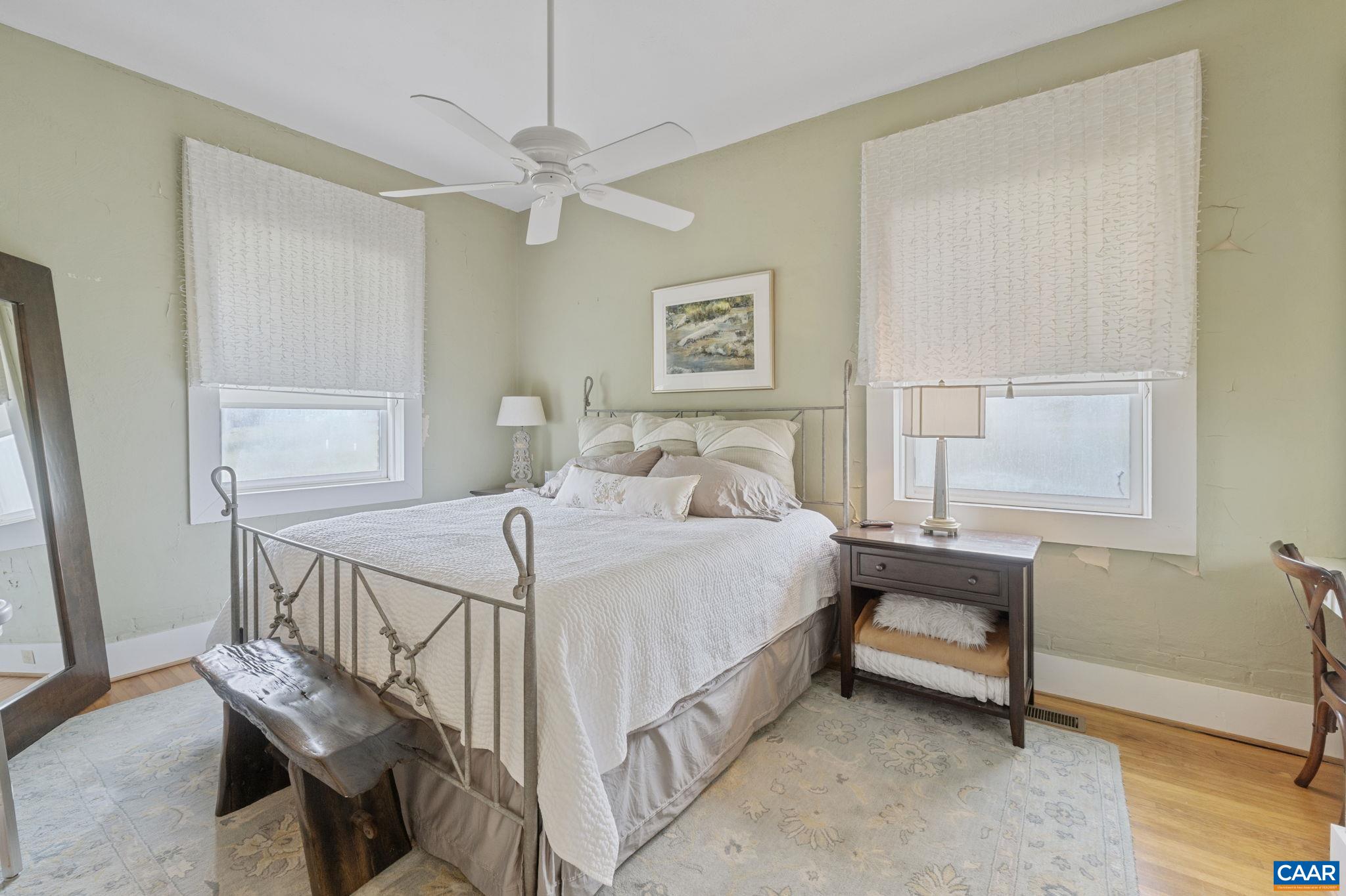 12189 Norwood Road Wingina, VA 24599 - Photo 44 of 75 a bedroom with a bed and a table in it