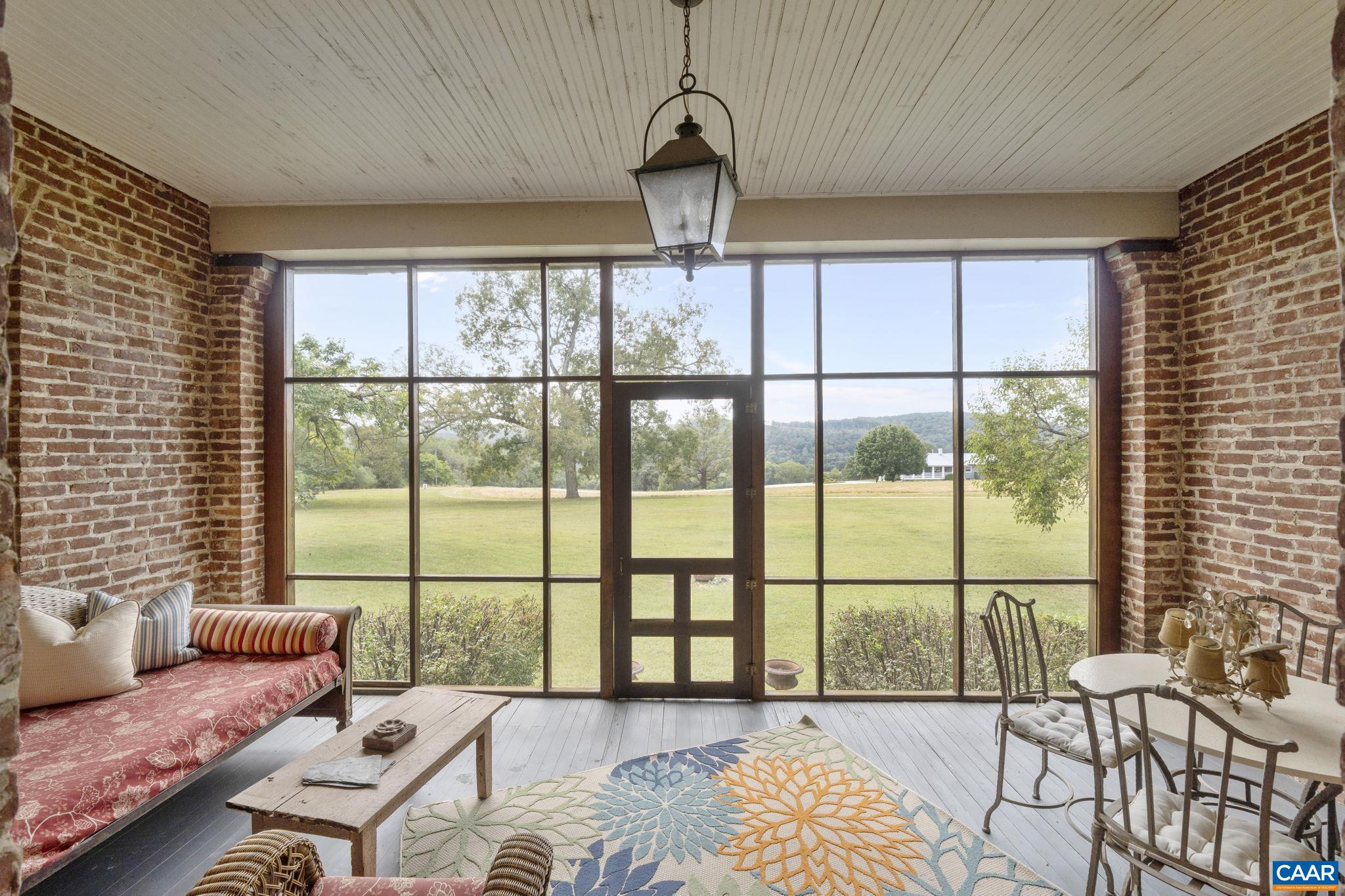 12189 Norwood Road Wingina, VA 24599 - Photo 48 of 75 a bedroom with furniture and large windows