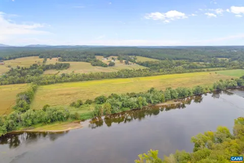 a bed room with a bed and a window