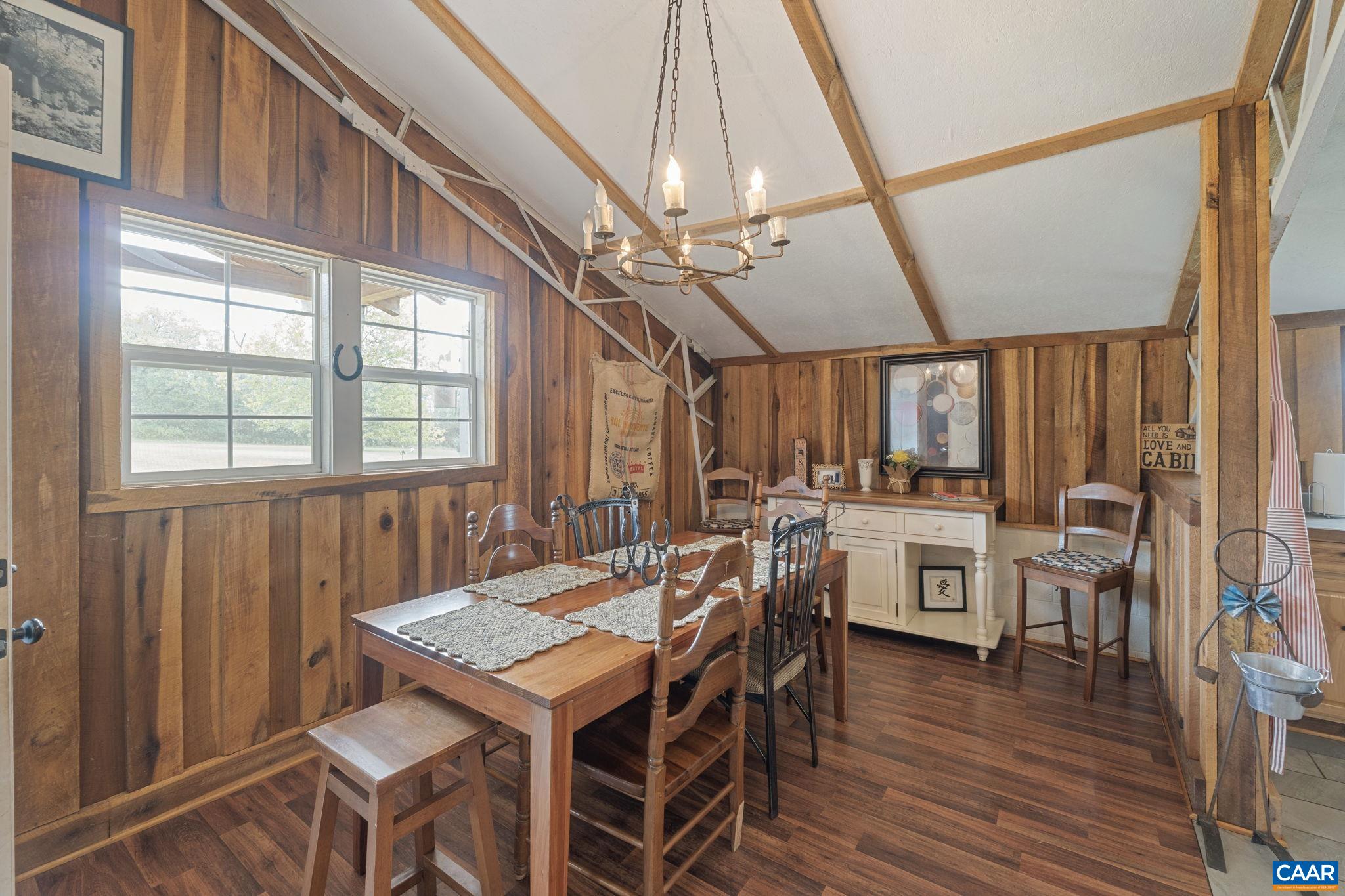 12189 Norwood Road Wingina, VA 24599 - Photo 60 of 75 a view of a dining room with furniture window and wooden floor