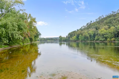 a view of a balcony with wooden floor