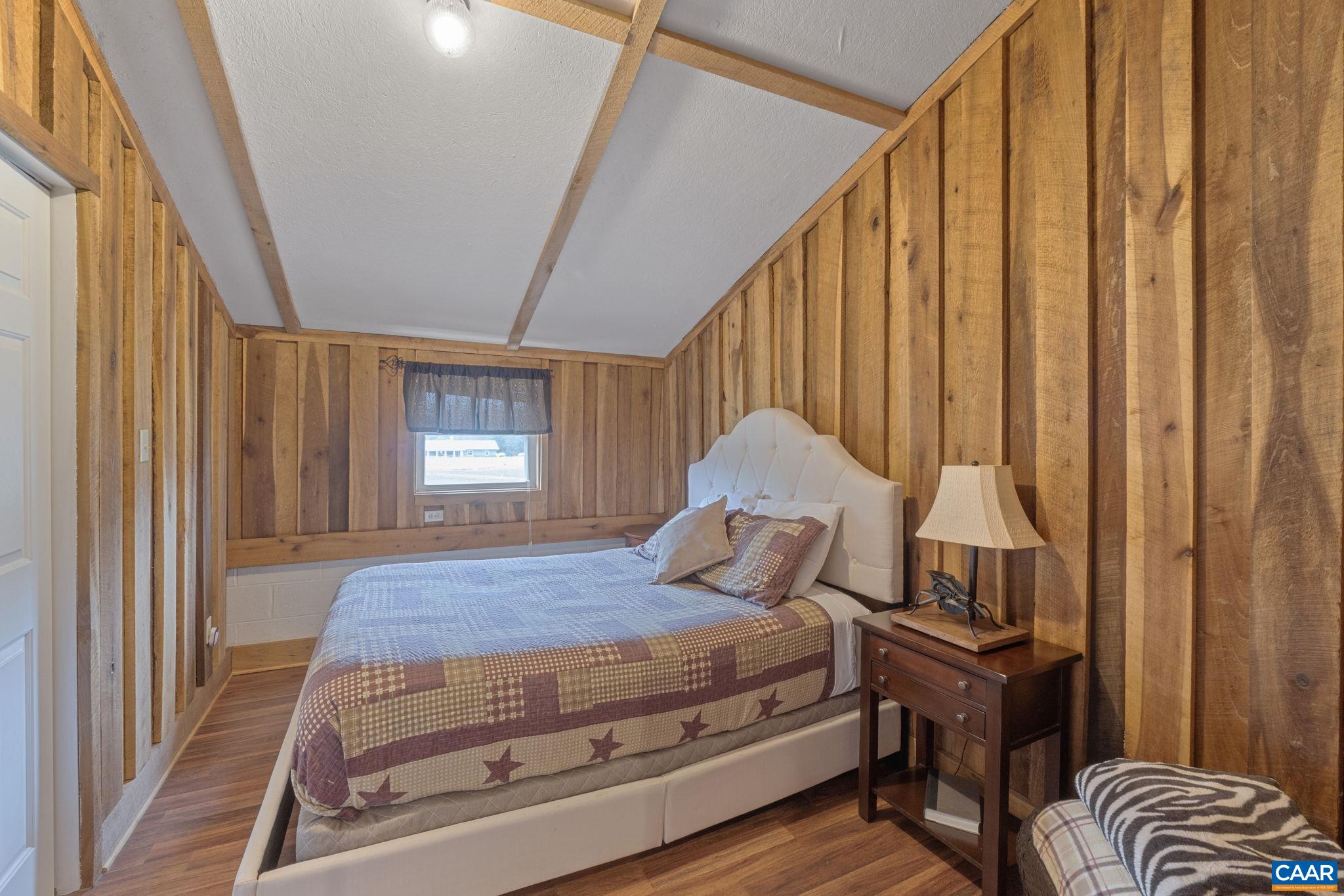 12189 Norwood Road Wingina, VA 24599 - Photo 63 of 75 a bedroom with a bed and a window