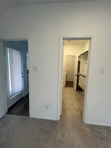 a view of a small space with a sink and a mirror
