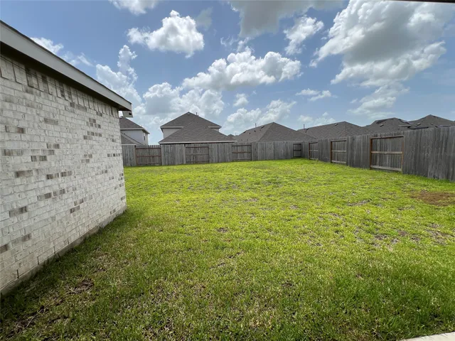 a view of a backyard of the house