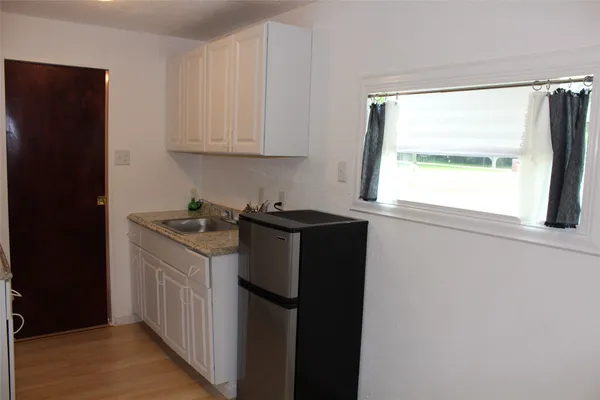 a utility room with window dryer and washer