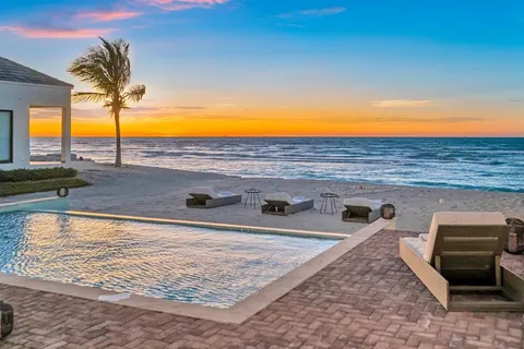 a view of a swimming pool with a lounge chair