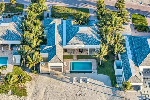 a front view of house with a garden