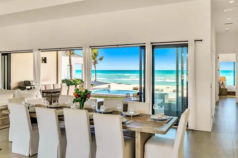 a room with furniture a large window and wooden floor