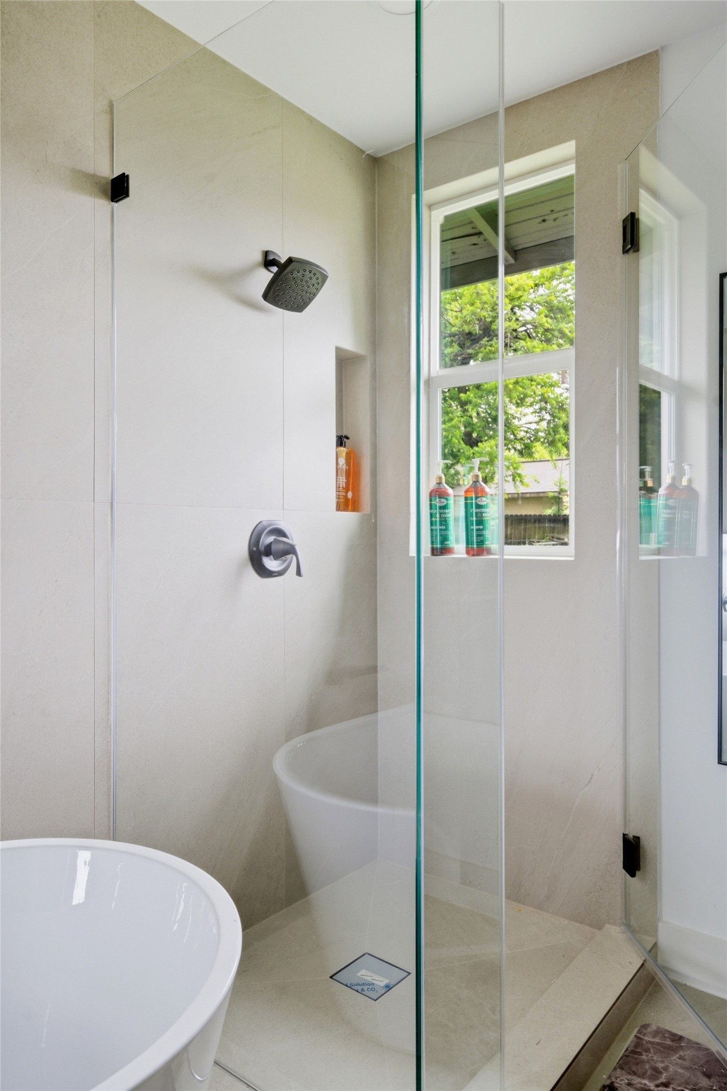 5114 Keystone Street Houston, TX 77021 - Photo 10 of 27 Spa-style bathroom with freestanding soaking tub and rain shower