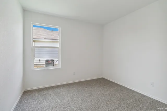 a view of an empty room and closet