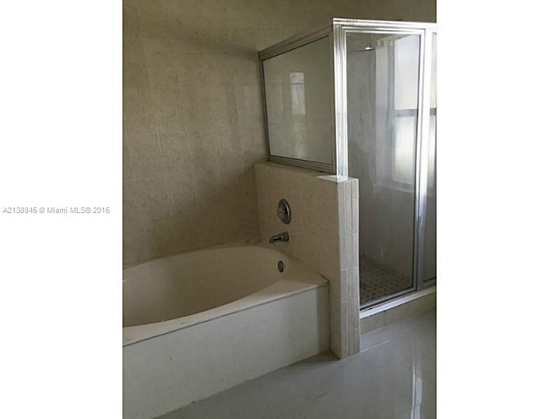 13674 Southwest 124th Avenue Road Miami, FL 33186 - Photo 12 of 21 a bathroom with a bathtub and shower