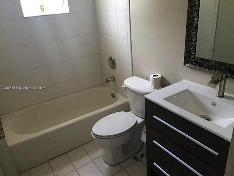 13674 Southwest 124th Avenue Road Miami, FL 33186 - Photo 13 of 21 a bathroom with a sink toilet and shower