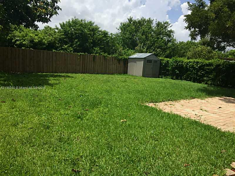 13674 Southwest 124th Avenue Road Miami, FL 33186 - Photo 3 of 21 a view of a backyard with small cabin