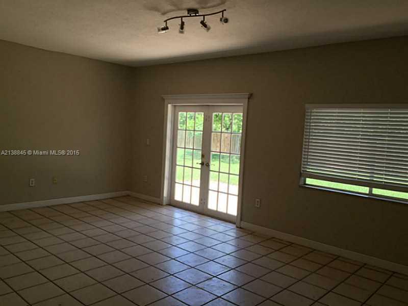 13674 Southwest 124th Avenue Road Miami, FL 33186 - Photo 8 of 21 a view of an empty room and window