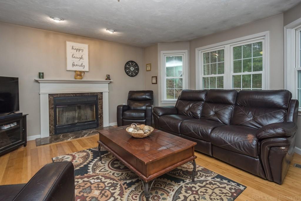 41 Tannery Road Sturbridge, MA 01518 - Photo 14 of 42 a living room with furniture a fireplace and a flat screen tv